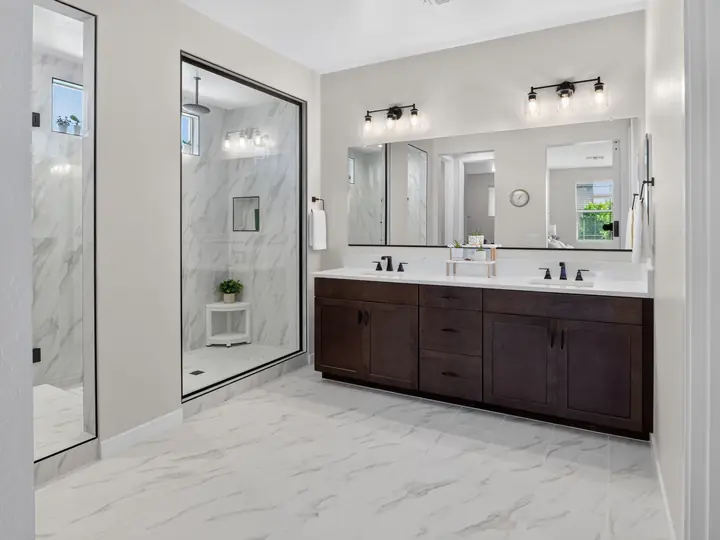 Bathroom with glass shower and double vanity