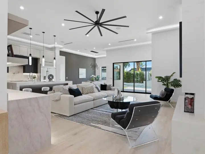Open great room with fireplace and sliding doors